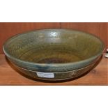 A Bernard Leech Studio pottery bowl, green bursting mottled craquelure glaze,