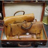 A brown leather suitcase,