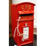 A reproduction cast metal George IV post box