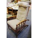 A late Victorian rosewood reclining chair, bobbin turned spindles and stretchers,