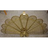 An Art Deco fan shaped fire guard, griffin decorated base c.