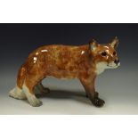 A Winstanley model of a fox, 31cm wide,