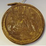 A Victorian patent seal in a leather case, embossed with Queen Victoria, seated on throne,