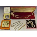 A silver curb link bracelet; another; a silver necklace chain; a part vesta case;