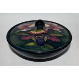 A Moorcroft Orchid pattern powder bowl and cover,