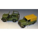 A reproduction pressed metal model, of a Jeep; another, similar, Jeep 4x4,