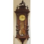 A late 19th century mahogany Vienna wallclock, Roman numerals,