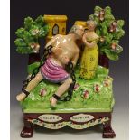 A Staffordshire figural group,