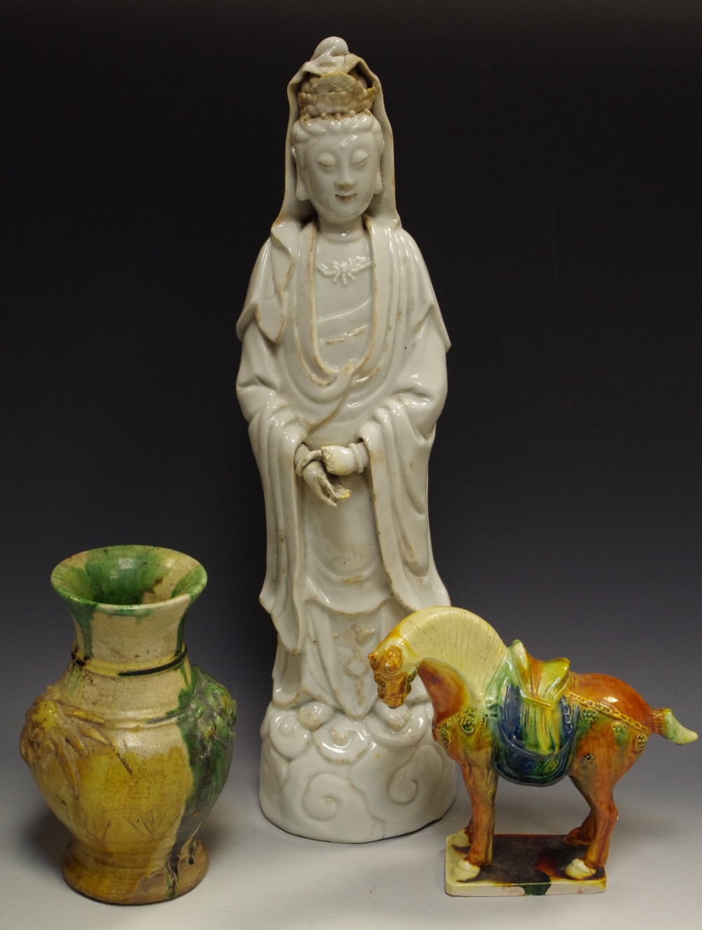 A Chinese blanc de chine figure, of a deity, 44cm high; a Chinese vase,