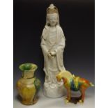 A Chinese blanc de chine figure, of a deity, 44cm high; a Chinese vase,