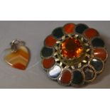 A large Scottish silver and agate brooch;