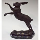 A bronzed metal sculpture, as a boxing hare, 29.