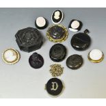 Jewellery - a Victorian black jet locket pendant, others similar, a brooches.