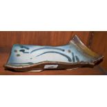 A salt glazed stoneware asymmetrical curved rectangular dish, by Jim Robison,