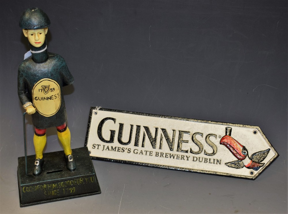 Advertising - a reproduction cast metal Guinness 'Bottle Man' money box; an advertising sign,