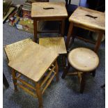 Two oak school stools circa 1930; three other oak stools;