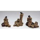 A set of three stoneware Chinese figure groups,