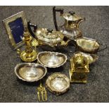 A silver plated four piece tea service; a brass lantern clock battery operated;