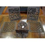 A pair of Oriental carved and pierced wooden panels, birds and flowers, 31cm x 25cm; another pair,