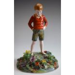 A Crown Staffordshire ceramic figure, Boy in Flower Meadow, modelled by T.