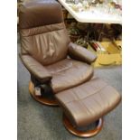 A Ekornes Stressless brown leather recliner with conforming footstool