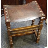 A 19th century oak joint stool, leather seat, bobbin turned and blocked legs,