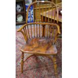 An elm Windsor chair, spindle back, saddle seat,