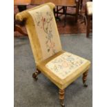 A Victorian mahogany prie-dieu, floral wool work back and seat,