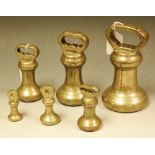 A set of six Victorian brass bell weights,