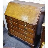 A George III oak fall front bureau, four drawers, fitted interior,