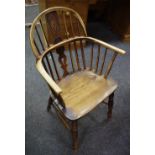 An elm Windsor chair, shaped and pierced splat, saddle seat,