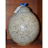 A stoneware ovoid vase and cover, by Helen Walters, speckled glazed in brown on an oatmeal ground,