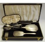 A silver four piece hair brush and hand mirror set, Birmingham 1963,