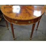 A George III style mahogany demi-lune side table, slightly oversailing top above a frieze drawer,