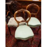 A pair of Victorian mahogany balloon back hall chairs; a Victorian hall chair,