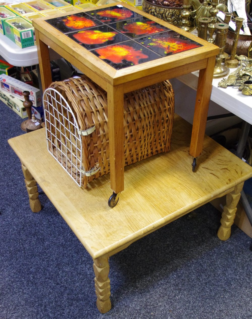 A contemporary pale oak coffee table, naively carved legs,