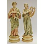 A pair of Austrian Royal Dux type figures, in classical dress, with musical instruments, 29cm,