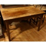 An early 20th century oak centre table, rectangular top above a shaped freeze,