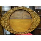 An oval marquetry inlaid walnut mirror frame, 27cm x 102cm,