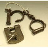 A pair of 19th century handcuffs, key marked no.