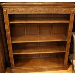 Old charm type oak open bookcase holding four shelves, moulded to frieze,