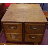 An early 20th century oak four drawer filing cabinet