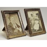 A pair of late Victorian/Edwardian silver rectangular easel photograph frames,
