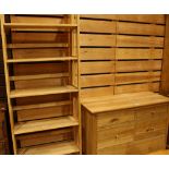 A contemporary light oak chest, oversailing rectangular top above an arrangement of drawers,