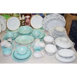 A Poole twin tone part dinner and tea service; a German Easterling porcelain part dinner service;