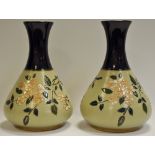 A pair of Lovatts Langley ribbed compressed baluster vases decorated with flowering branches