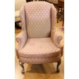 A George III design wingback reception armchair, scroll arm,