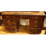 A '19th century' campaign style twin pedestal writing desk,