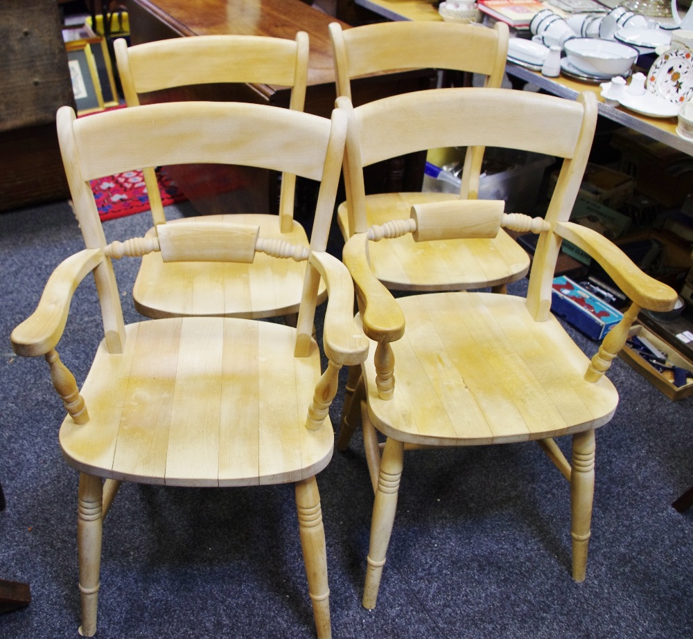 A set of four beech country kitchen dining chairs including two carvers