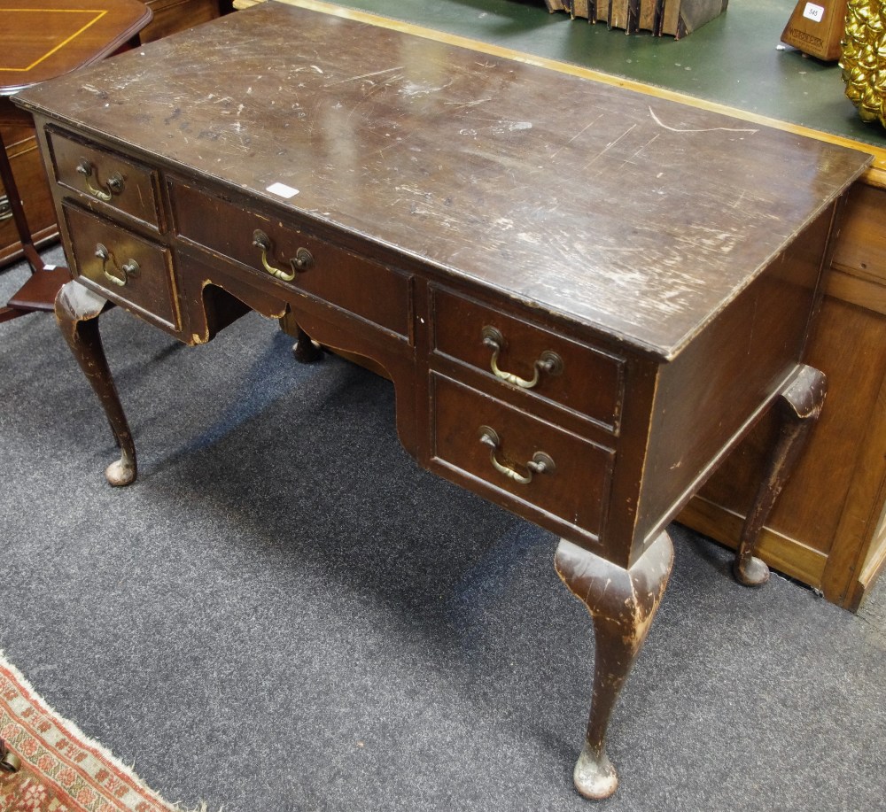 A reproduction dressing table, rectangular top, one long and four short drawers, cabriole legs,